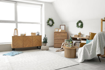 Wall Mural - Interior of festive living room with wooden furniture and Christmas decorations