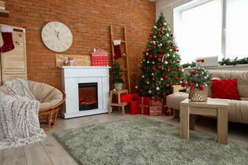 Poster - Interior of festive living room with Christmas tree, white sofa and fireplace