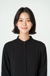 © supattra - Portrait of a Young Woman with Layered Haircut in Minimalist black Outfit