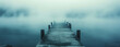 © CreativePulse - serene old boat dock shrouded in thick fog creates mysterious atmosphere over calm water. stillness evokes sense of tranquility and contemplation