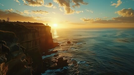 Wall Mural - A dramatic cliffside overlooking the ocean, with a couple enjoying the view and the sun setting in the distance, casting a beautiful glow.