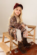 © Cavan Images - Portrait of a beautiful smiling 7 years old girl. Close-up, studio.