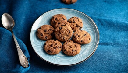 Wall Mural - Brown Bliss: Chocolate Chip Cookies on a Blue Canvas