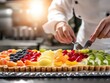 © tantawat - Chef Preparing Fresh Fruit Tart in Kitchen