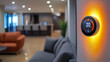 © Komkrit - A sleek smart thermostat mounted on a minimalist wall in a modern home, with soft ambient lighting that highlights its touchscreen display, symbolizing energy efficiency and smart home integration