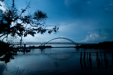 A view of Kahayan Bridge before sunset. It is a 640 meters long and 9 meters wide bridge over Kahayan river in Central Kalimantan, Indonesia. 