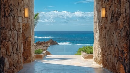Poster - View between 2 stone walls, access to a hotel lobby with ocean view in the back.