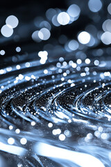 Poster - A stunning close-up of shimmering water droplets on a smooth surface, highlighting intricate details and beautiful reflections in soft blue tones.