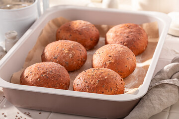 Brown and hot flax seed buns baked in a bakehouse.