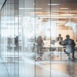 © Korawan - A blurred image of business people working in a white glass office. Stock image., AI Generative