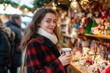 © Kenny - Smiling woman enjoying festive atmosphere at christmas market