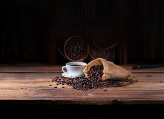 Poster - A white cup of coffee with coffee beans scattered on a wooden table.