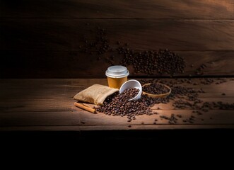 Poster - Coffee beans, a burlap sack, and a paper cup on a wooden surface.