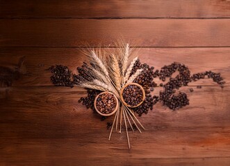 Poster - Two bowls of coffee beans with wheat stalks on rustic wooden surface.
