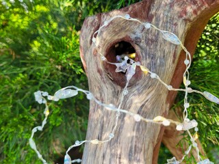 wooden sculpture handmade with garland