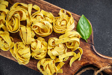 raw pasta tagliatelle chia seeds vegetable dish Fresh delicious gourmet food background on the table rustick food top view copy space