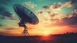 © Youttakone - A satellite dish silhouettes against a vibrant sunset, with colorful clouds creating a scenic, tranquil atmosphere.