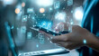 © Elnare - A person using a smartphone with digital icons and lines connecting them, a laptop in the background.
