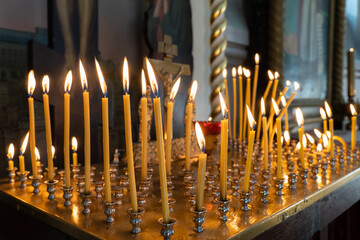 Burning candles in Christian church.  21.09.2024. Daugavpils. Latvia. .