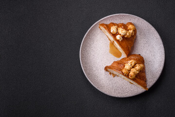 Sweet crispy croissant with salted caramel and glazed popcorn