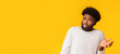 © Prostock-studio - Unreal offer. Amazed black young man looking at free space, panorama