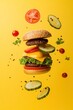 © Minerva Studio - Delicious burger floating on a yellow background with ingredients