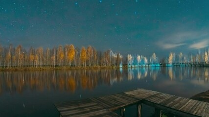 Poster - Slider shot of Deep Night Stars Above Lake. Natural Starry Sky Landscape. Wooden Pier. Autumn Forest woods lake . Amazing Landscape Woodland Slider Time Lapse, Time-lapse. reflection on water surface