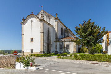 constância, portugal. 13 august 2024, view of our lady of martyrs catholic church with a blue sky.