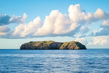 Poster - Small island with green vegetation and blue sky with clouds