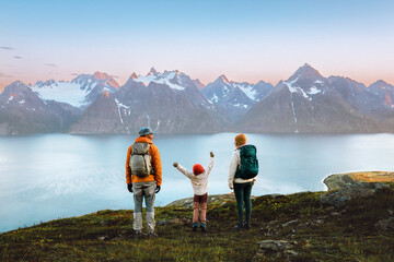 Wall Mural - family mother, father, and kid hiking together in norway, travel lifestyle adventure vacations in ly