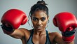 © Alon - Mixed race woman with boxing gloves