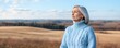© ratatosk - Senior woman in wheat field landscape. Wellness and health concept. Healthy aging. Mindfulness and calmness. Banner with copy space