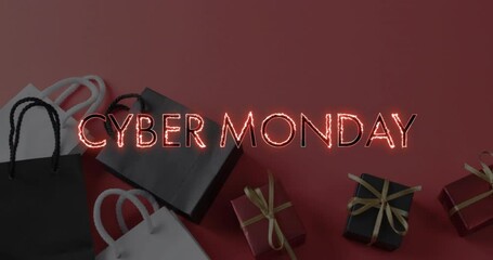 Poster - animation of cyber monday text over shopping bags and presents