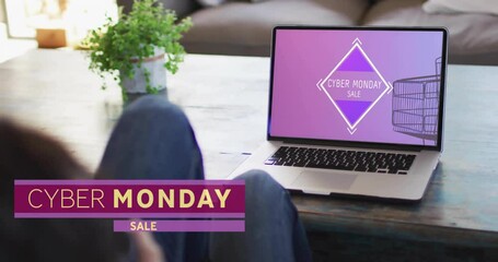 Poster - Animation of cyber monday text over woman using laptop with shopping cart on screen