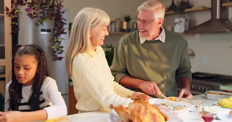 Wall Mural - Senior, people and laughing with food for thanksgiving in kitchen with family, happiness and feast for festive celebration. Grandparents, child and together in home with turkey and conversation.