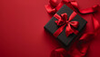 © RJ.RJ. Wave - Black gift with a red bow on a red background with empty space – perfect for holiday themes and gift-giving