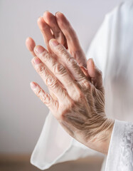 close up, senior woman in calm environment, doing stretching, yoga or tai chi exercises, physical and mental health concept, wellness outdoors, space for text 