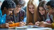 © Sasint - A group of teenagers from different ethnic backgrounds working on a school project, representing collaboration and diversity