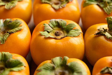 Ripe persimmon fruit texture background