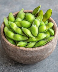 Poster - Fresh green lime wedges in a rustic ceramic bowl