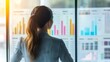 © admin_design - Businesswoman Analyzing Data Charts and Graphs on Whiteboard