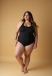 © Eliane - Curvy Beauty: Plus-Size Model in Black Swimsuit Posing on the Floor