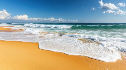 Relax on a sunny beach where soft golden sand meets gentle ocean waves under a bright blue sky adorned with fluffy clouds