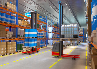 Poster - Warehouse fuels and lubricants. Forklift robots in logistics center. Machine for lifting pallets to top shelf. Warehouse robots in industrial building. Storage area at chemical production. 3d image