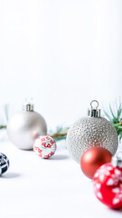 Wall Mural - Silver and Red Christmas Ornaments on White Background