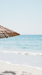 Sticker - Straw Beach Umbrella Overlooking the Ocean