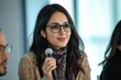 © Shooting Star Std - A Muslim Female CEO Participates In A Panel Discussion. She Shares Her Insights And Experiences With Other Industry Leaders, Generative AI
