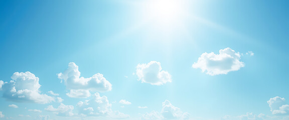 Wall Mural - Bright blue sky with white clouds and sun shining through