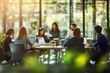 © Panuwat - Group people sitting around table modern office space Blurred interior