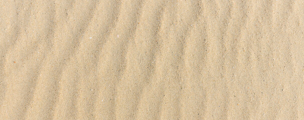 Sand texture. Sandy beach for background. Top view. Natural sand stone texture background. sand on the beach as background. Wavy sand background for summer designs.